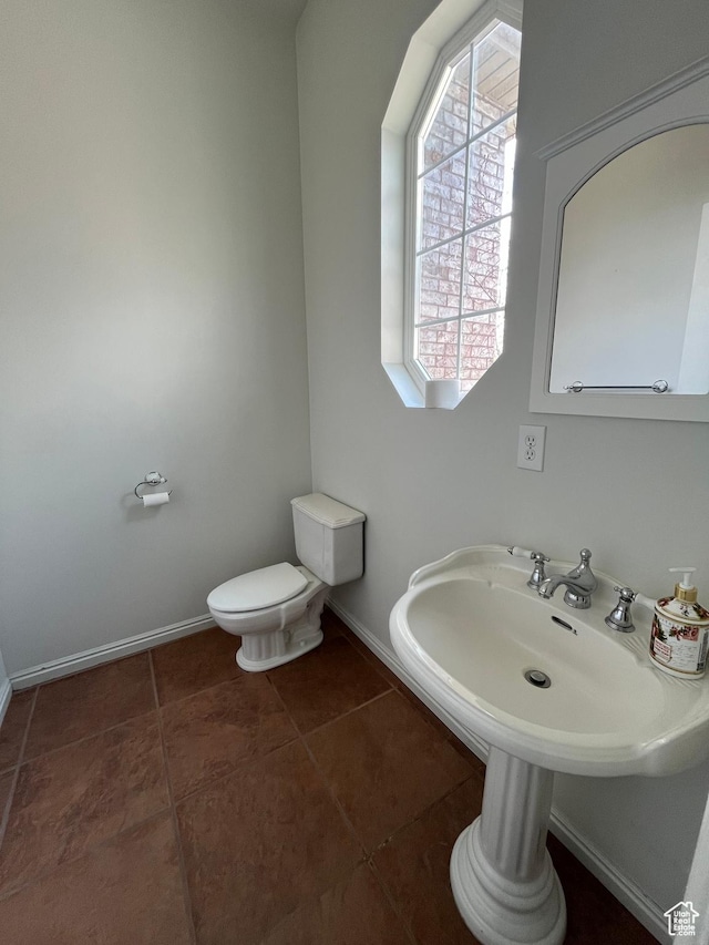 407 W Larkspur Ln, Morgan, UT 84050 - bathroom featuring baseboards, toilet, and tile patterned floors