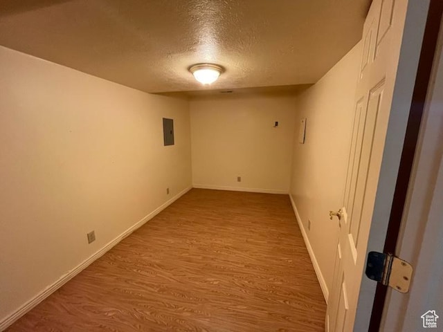 407 W Larkspur Ln, Morgan, UT 84050 - finished below grade area featuring electric panel, baseboards, wood finished floors, and a textured ceiling