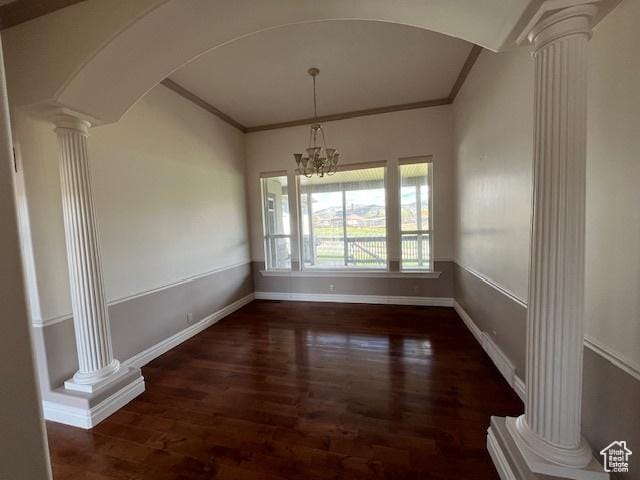 407 W Larkspur Ln, Morgan, UT 84050 - unfurnished dining area with wood finished floors, ornamental molding, and decorative columns