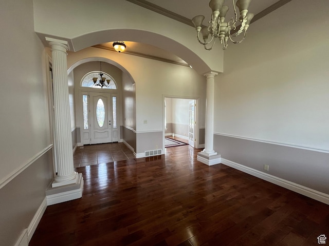 407 W Larkspur Ln, Morgan, UT 84050 - entryway featuring hardwood / wood-style floors, arched walkways, baseboards, a notable chandelier, and visible vents