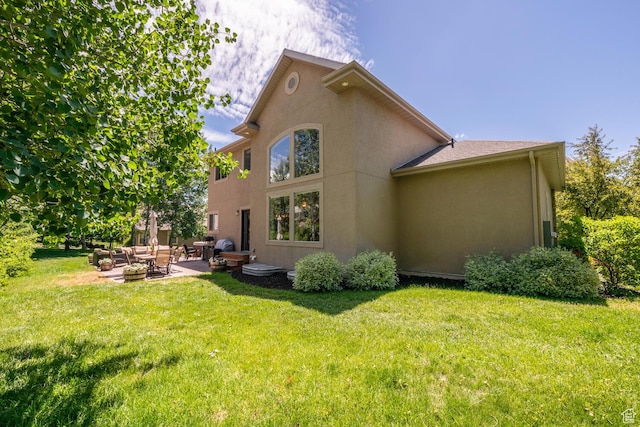 1984 N Cherry Ln, Heber City, UT 84032 - rear view of house featuring a lawn, outdoor lounge area, a patio, and stucco siding