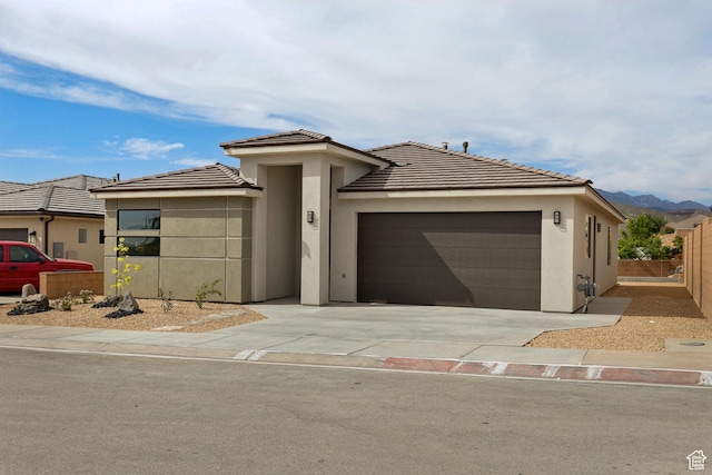 3618 W 185 N, Hurricane, UT 84737 - view of front of property featuring fence, stucco siding, a tile roof, driveway, and a garage