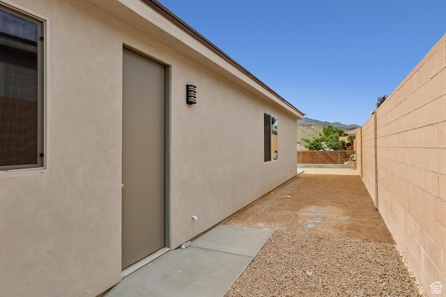 3618 W 185 N, Hurricane, UT 84737 - view of property exterior featuring a fenced backyard, stucco siding, and a mountain view