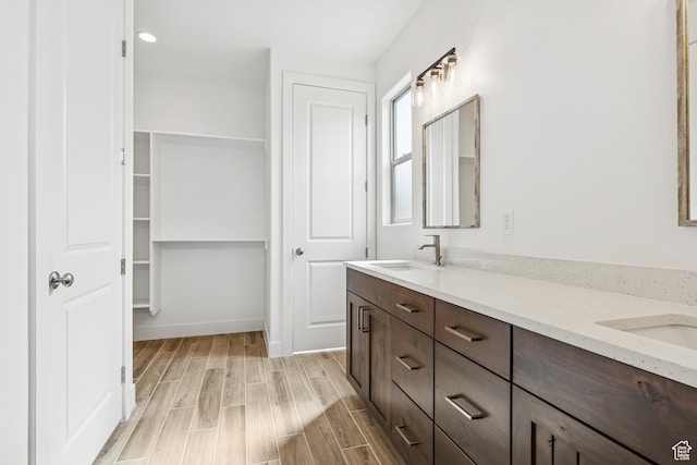 3618 W 185 N, Hurricane, UT 84737 - bathroom with double vanity, wood finished floors, and a sink