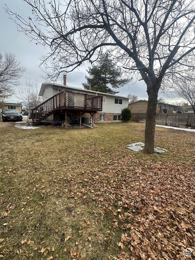 4584 S Knightsbridge Rd, Taylorsville, UT 84129 - exterior space featuring a wooden deck, a yard, stairway, and fence