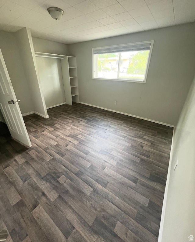4584 S Knightsbridge Rd, Taylorsville, UT 84129 - unfurnished bedroom featuring baseboards, dark wood-type flooring, and a closet