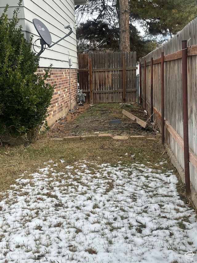 4584 S Knightsbridge Rd, Taylorsville, UT 84129 - yard covered in snow with fence