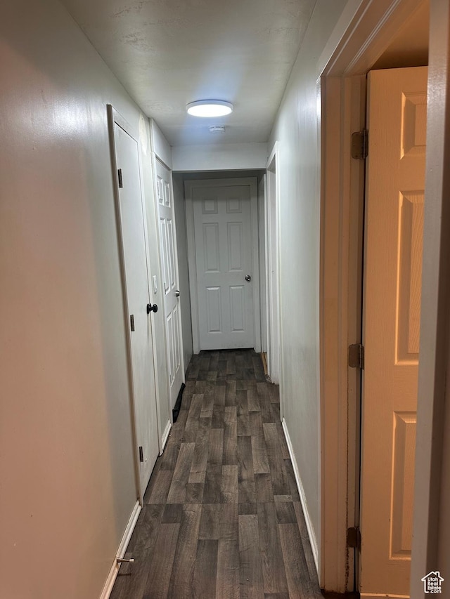 4584 S Knightsbridge Rd, Taylorsville, UT 84129 - corridor featuring baseboards and dark wood-type flooring