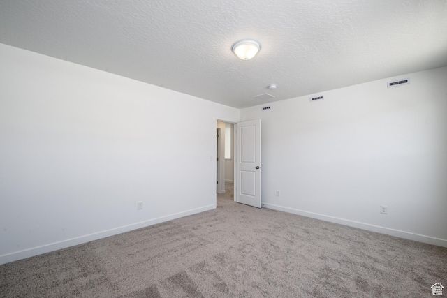 1784 E Bison Dr Unit B234, Eagle Mountain, UT 84005 - unfurnished room featuring visible vents, baseboards, and light carpet