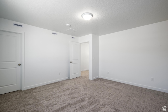 1784 E Bison Dr Unit B234, Eagle Mountain, UT 84005 - carpeted empty room featuring baseboards, a textured ceiling, and visible vents