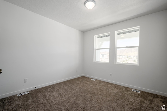 1784 E Bison Dr Unit B234, Eagle Mountain, UT 84005 - carpeted spare room with visible vents and baseboards