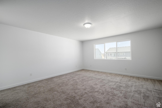 1784 E Bison Dr Unit B234, Eagle Mountain, UT 84005 - carpeted empty room with baseboards and a textured ceiling