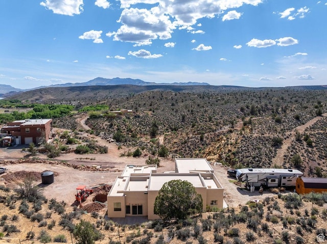 aerial view featuring view of desert and a mountain view