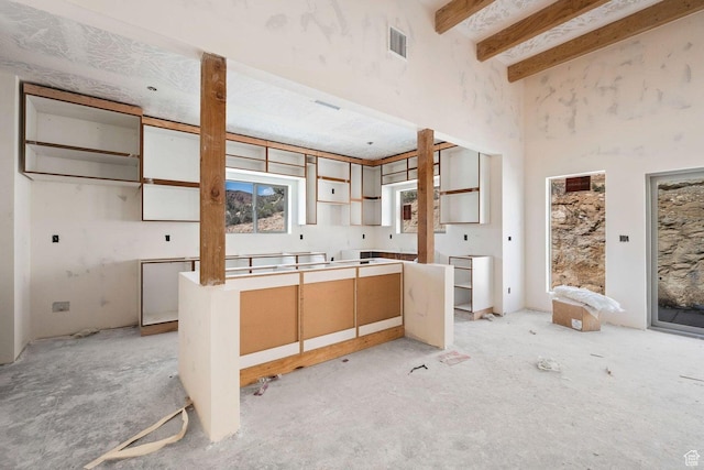 126 W Bowler Rd, Gunlock, UT 84733 - kitchen with beam ceiling, a towering ceiling, and visible vents