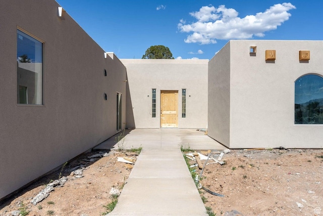 126 W Bowler Rd, Gunlock, UT 84733 - rear view of property with a patio and stucco siding