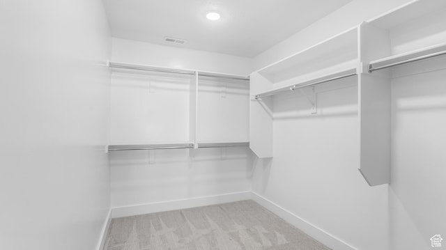 794 Brook Ave E, Tooele, UT 84074 - walk in closet featuring light carpet and visible vents