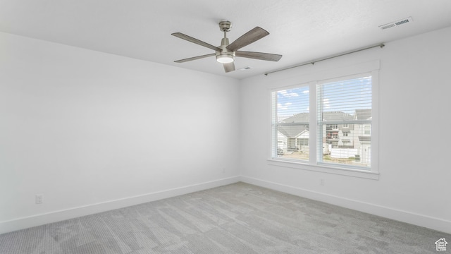 794 Brook Ave E, Tooele, UT 84074 - unfurnished room featuring light carpet, a ceiling fan, visible vents, and baseboards