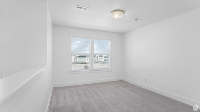 794 Brook Ave E, Tooele, UT 84074 - unfurnished room featuring baseboards, visible vents, and carpet flooring