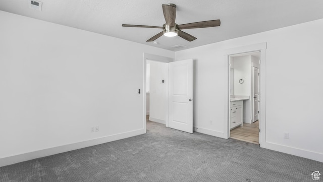 794 Brook Ave E, Tooele, UT 84074 - unfurnished bedroom featuring carpet, visible vents, a ceiling fan, ensuite bath, and baseboards