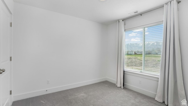 794 Brook Ave E, Tooele, UT 84074 - unfurnished room with visible vents, light carpet, and baseboards
