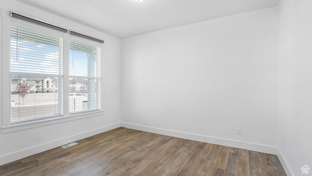 794 Brook Ave E, Tooele, UT 84074 - spare room featuring baseboards, a healthy amount of sunlight, and visible vents