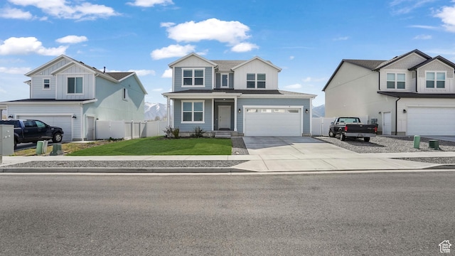 794 Brook Ave E, Tooele, UT 84074 - traditional-style home with concrete driveway, fence, an attached garage, board and batten siding, and a front yard