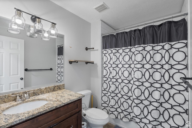 bathroom with a textured ceiling, vanity, shower / bath combination with curtain, toilet, and visible vents
