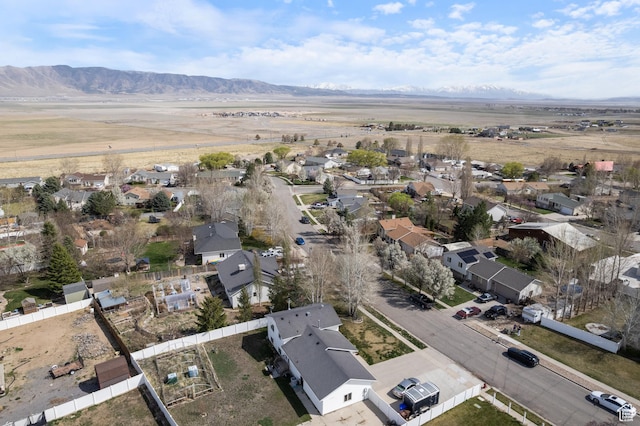 drone / aerial view with a residential view and a mountain view