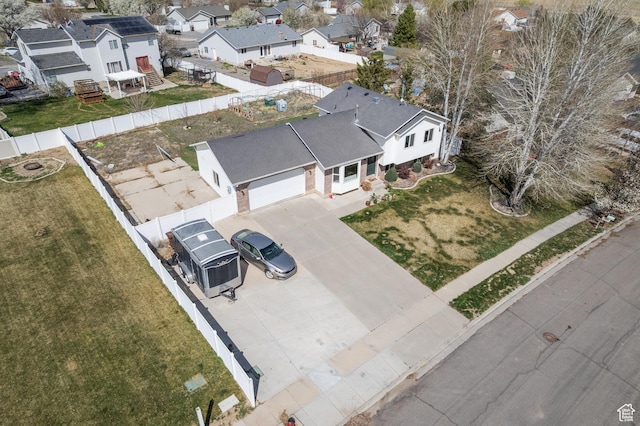birds eye view of property with a residential view