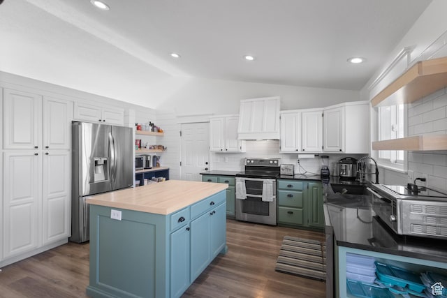 kitchen featuring white cabinets, stainless steel appliances, a sink, lofted ceiling, and open shelves