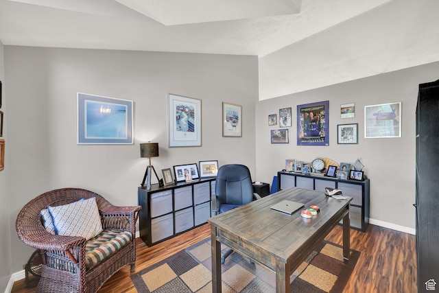 office featuring vaulted ceiling, wood finished floors, and baseboards