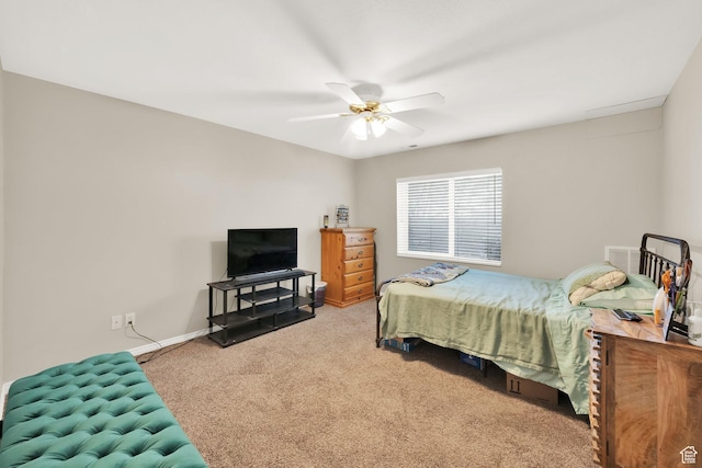 carpeted bedroom featuring baseboards and ceiling fan