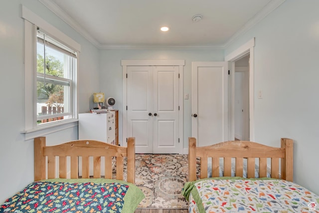 bedroom featuring a closet and ornamental molding