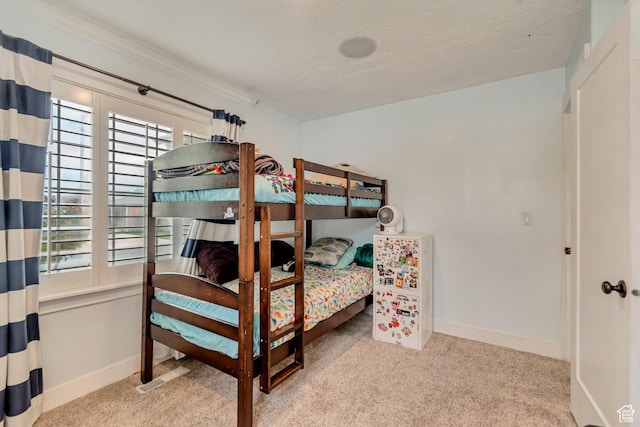 carpeted bedroom with baseboards