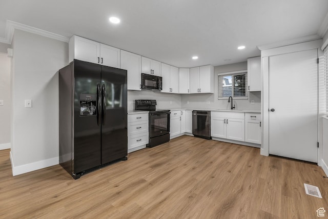 1210 W 4365 S Unit 3A, Taylorsville, UT 84123 - kitchen with ornamental molding, black appliances, light wood-style floors, and a sink