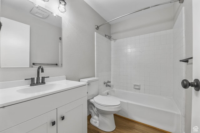 1210 W 4365 S Unit 3A, Taylorsville, UT 84123 - bathroom featuring toilet, vanity, bathtub / shower combination, wood finished floors, and a textured wall