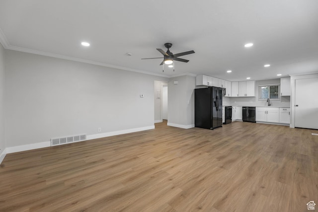 1210 W 4365 S Unit 3A, Taylorsville, UT 84123 - unfurnished living room with crown molding, baseboards, visible vents, and recessed lighting