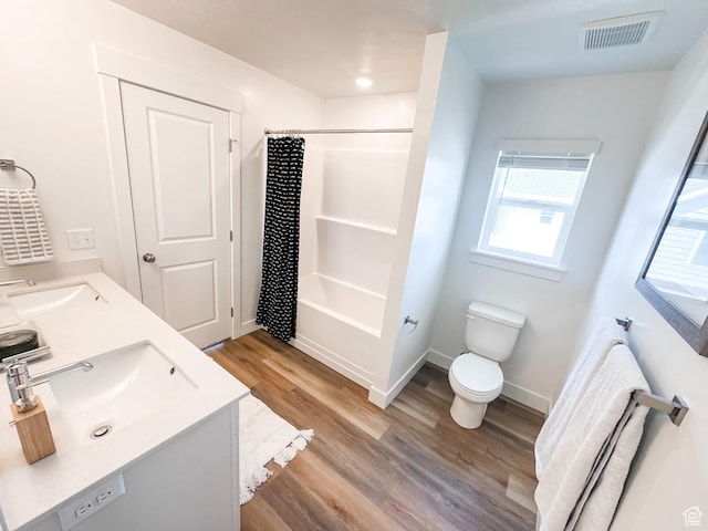 627 W 575 N Unit 545, Smithfield, UT 84335 - full bath featuring toilet, wood finished floors, a sink, and visible vents