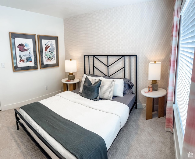 627 W 575 N Unit 545, Smithfield, UT 84335 - carpeted bedroom featuring baseboards, multiple windows, and wallpapered walls