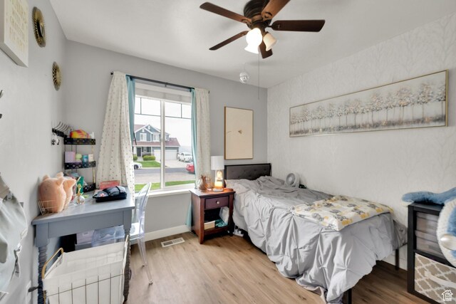 4104 Rose Springs Rd Unit 406, Erda, UT 84074 - bedroom with baseboards, a ceiling fan, wood finished floors, and visible vents