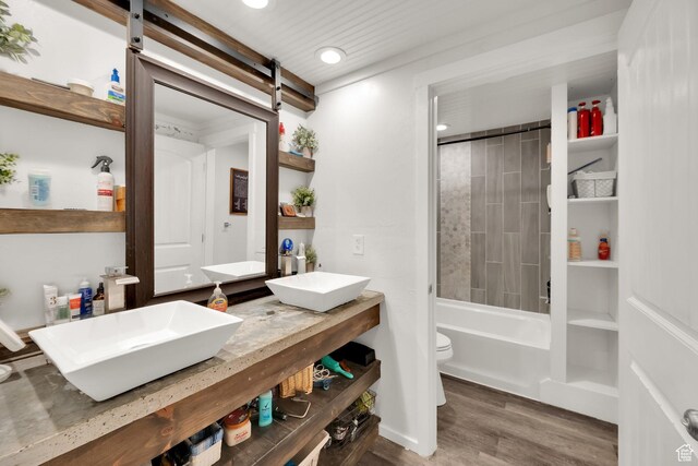 4104 Rose Springs Rd Unit 406, Erda, UT 84074 - full bath with recessed lighting, wood finished floors, toilet, and a sink