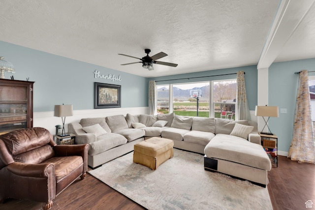 4104 Rose Springs Rd Unit 406, Erda, UT 84074 - living room with wood finished floors, a textured ceiling, and a ceiling fan