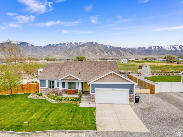 4104 Rose Springs Rd Unit 406, Erda, UT 84074 - single story home with a garage, concrete driveway, fence, and a mountain view