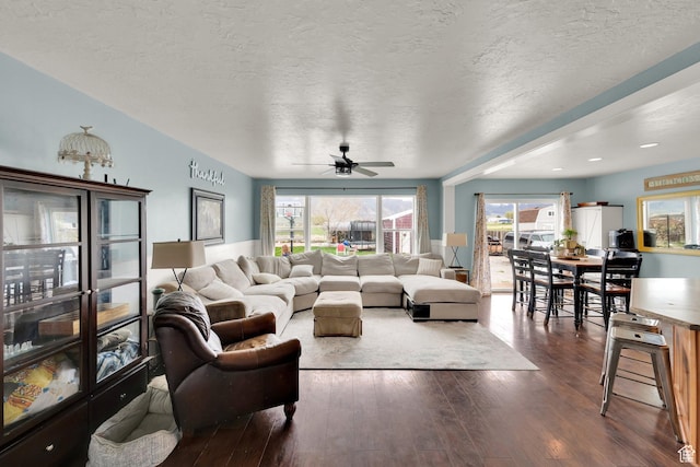 4104 Rose Springs Rd Unit 406, Erda, UT 84074 - living area with ceiling fan, a wealth of natural light, and dark wood-style flooring