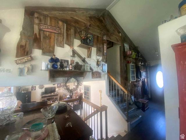 stairway with vaulted ceiling