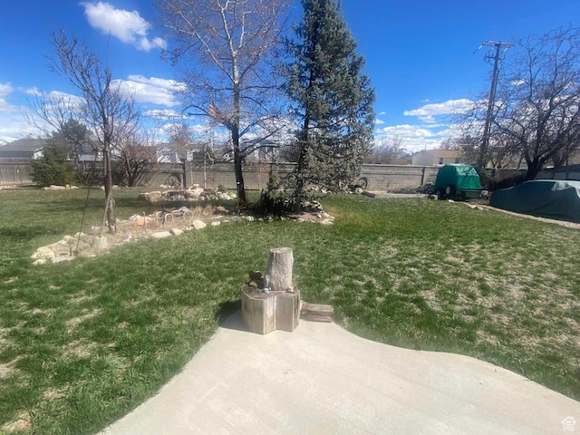 view of yard with fence and a patio area