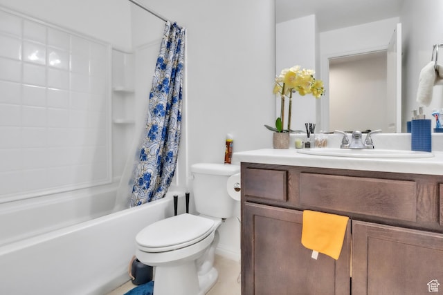 full bath with toilet, vanity, and shower / bath combo with shower curtain