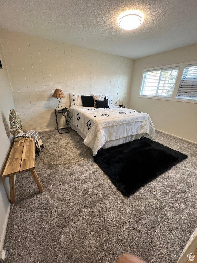 635 N 1200 W Unit A-306, Salt Lake City, UT 84116 - bedroom with baseboards, a textured ceiling, and carpet