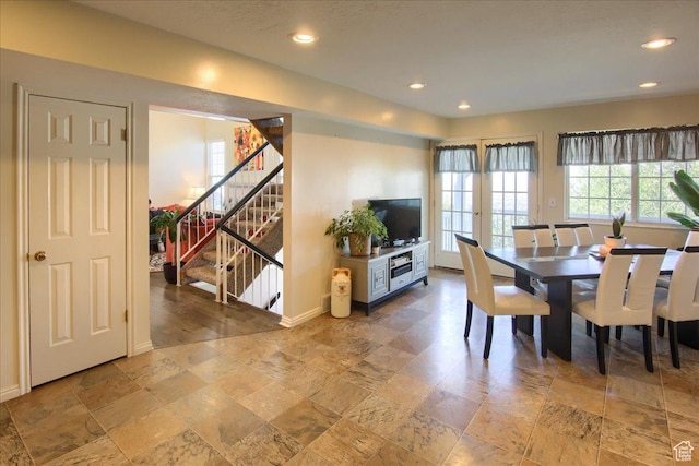 dining area with baseboards, stone finish floor, stairs, and recessed lighting