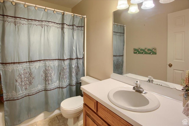 full bathroom featuring tile patterned flooring, toilet, and vanity